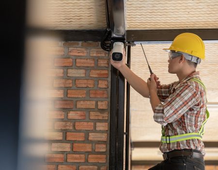 Technician installing CCTV camera for security.Technician worker installing video surveillance camera